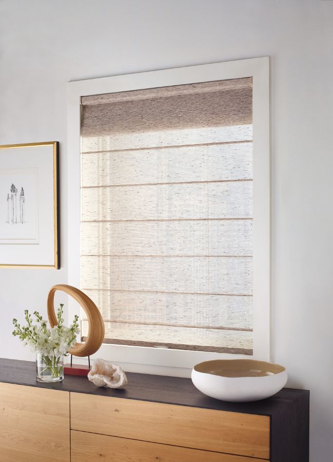 simple Hunter Douglas blinds in a hallway window with stylish side table